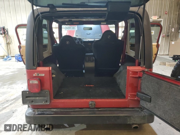 1999 Jeep Wrangler SE with VIN 1J4FY29P4XP476343, listed as a Copart auction lot 88799545 with 99,782 mi miles and Salvage Title. Bid and sale history available at carsss.com. Image 6.