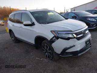 2021 Honda Pilot Touring 8-Passenger z VIN 5FNYF6H91MB038528, wystawiony jako IAAI lot #41248654 z przebiegiem 42 235 mil mil oraz . Historia ofert i sprzedaży dostępna na DreamBid. Obrazek 1.