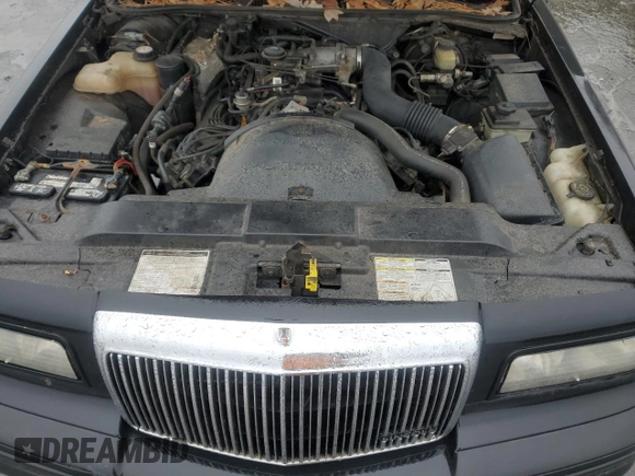 1997 Lincoln Town Car Executive z VIN 1LNLM81W7VY720905, wystawiony jako Copart lot #85910534 z przebiegiem Nie podano mil oraz Szkoda całkowita • Salvage title. Historia ofert i sprzedaży dostępna na DreamBid. Obrazek 12.