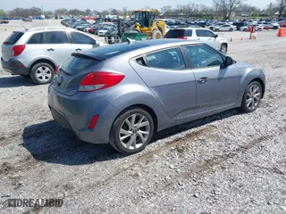 2017 Hyundai Veloster with VIN KMHTC6AD8HU305853, listed as a IAAI auction lot 41915404 with 115,663 mi miles. Bid and sale history available at carsss.com. Image 4.