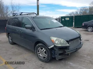 2007 Honda Odyssey EX-L z VIN 5FNRL38657B421667, wystawiony jako IAAI lot #41862741 z przebiegiem 233 824 mil mil oraz . Historia ofert i sprzedaży dostępna na DreamBid. Obrazek 1.