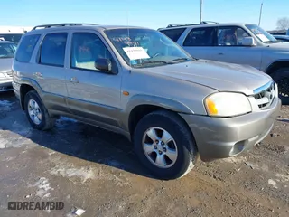2002 Mazda Tribute LX with VIN 4F2YU08122KM34058, listed as a IAAI auction lot 41439941 with 138,725 mi miles. Bid and sale history available at carsss.com. Image 1.
