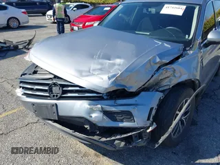 2021 Volkswagen Tiguan S with VIN 3VV1B7AX6MM131036, listed as a IAAI auction lot 41742604 with 55,155 mi miles and . Bid and sale history available at DreamBid. Image 6.