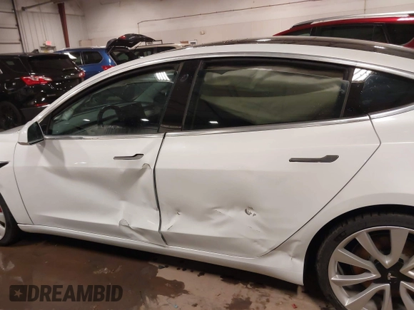 2018 Tesla Model 3 Long Range Battery with VIN 5YJ3E1EB5JF084446, listed as a IAAI auction lot 41209852 with 70,125 mi miles and . Bid and sale history available at DreamBid. Image 15.