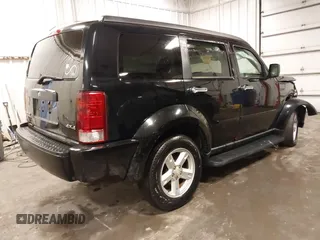 2007 Dodge Nitro SXT with VIN 1D8GU28K67W663621, listed as a IAAI auction lot 41691529 with 211,556 mi miles. Bid and sale history available at carsss.com. Image 4.