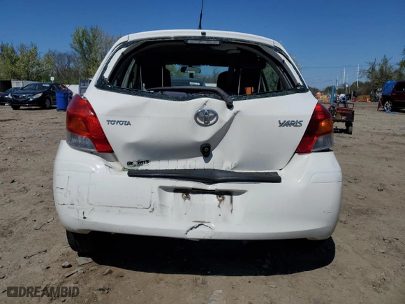 2009 Toyota Yaris with VIN JTDKT903695248767, listed as a Copart auction lot 52327265 with 211,184 mi miles and Salvage Title. Bid and sale history available at carsss.com. Image 6.