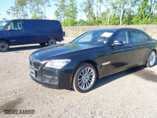 2015 BMW 7 Series 750Li with VIN WBAYE8C50FD781384, listed as a IAAI auction lot 42049829 with 128,087 mi miles. Bid and sale history available at carsss.com. Image 2.
