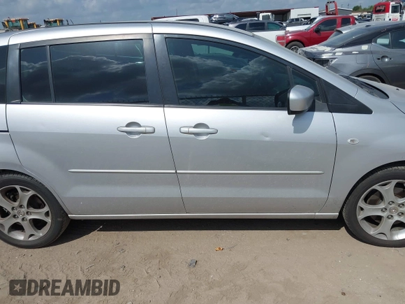 2009 Mazda 5 Sport z VIN JM1CR293090355422, wystawiony jako IAAI lot #42567279 z przebiegiem 214 402 mil mil oraz . Historia ofert i sprzedaży dostępna na DreamBid. Obrazek 13.