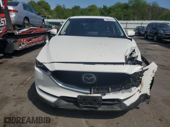 2021 Mazda CX-5 Touring with VIN JM3KFBCM7M0386995, listed as a Copart auction lot 55255784 with 43,561 mi miles and Salvage Title. Bid and sale history available at carsss.com. Image 5.