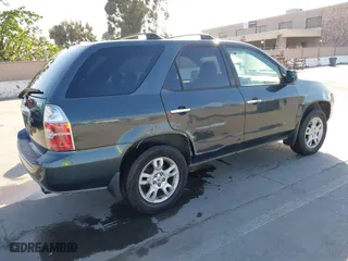 2006 Acura MDX Touring with VIN 2HNYD18726H533142, listed as a IAAI auction lot 42007839 with 216,910 mi miles. Bid and sale history available at carsss.com. Image 4.