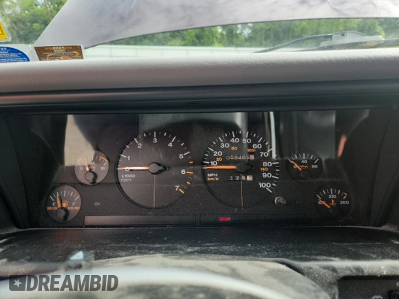 1994 Jeep Grand Cherokee Laredo z VIN 1J4GZ58S0RC221854, wystawiony jako Copart lot #61950825 z przebiegiem 69 465 mil mil oraz Czysty tytuł • Clean title. Historia ofert i sprzedaży dostępna na DreamBid. Obrazek 9.