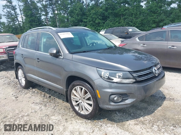 2014 Volkswagen Tiguan SE z VIN WVGAV3AX0EW576108, wystawiony jako IAAI lot #42405804 z przebiegiem 117 530 mil mil oraz . Historia ofert i sprzedaży dostępna na DreamBid. Obrazek 1.