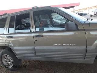 1998 Jeep Grand Cherokee Laredo with VIN 1J4GZ58S9WC136684, listed as a IAAI auction lot 41444103 with 1 mi miles. Bid and sale history available at carsss.com. Image 12.