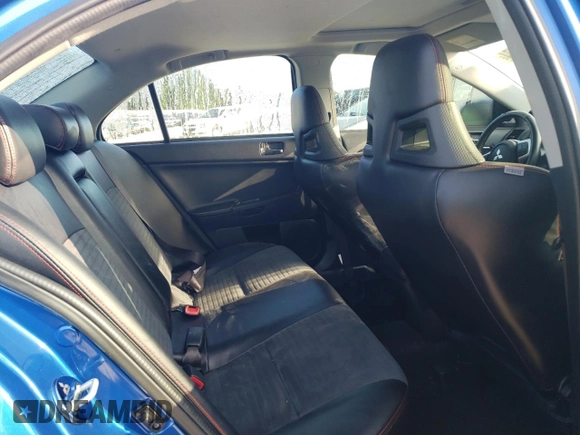 2015 Mitsubishi Lancer Evolution Final Edition z VIN JA32W7FV7FU608214, wystawiony jako Copart lot #68316174 z przebiegiem 56 714 mil mil oraz Szkody całkowita. Historia ofert i sprzedaży dostępna na DreamBid. Obrazek 10.