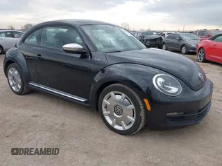 2013 Volkswagen Beetle 2.5L with VIN 3VWJP7AT8DM679548, listed as a IAAI auction lot 41459613 with 135,198 mi miles and . Bid and sale history available at DreamBid. Image 1.