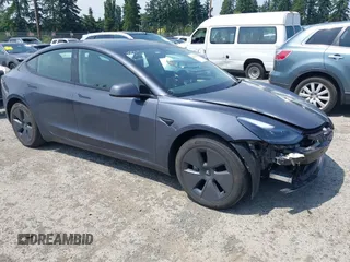 2023 Tesla Model 3 with VIN 5YJ3E1EA3PF695611, listed as a IAAI auction lot 42571002 with 13,482 mi miles and . Bid and sale history available at DreamBid. Image 1.