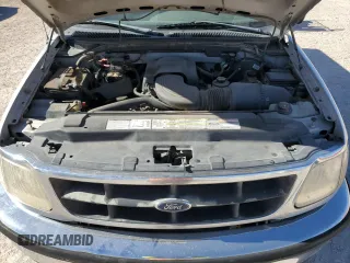 1998 Ford F-150 z VIN 1FTZF1762WKA87421, wystawiony jako Copart lot #86973334 z przebiegiem 217 978 mil mil oraz Szkoda całkowita • Salvage title. Historia ofert i sprzedaży dostępna na DreamBid. Obrazek 13.
