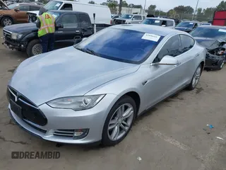 2013 Tesla Model S with VIN 5YJSA1DG7DFP11382, listed as a IAAI auction lot 42056169 with 126,975 mi miles. Bid and sale history available at carsss.com. Image 6.