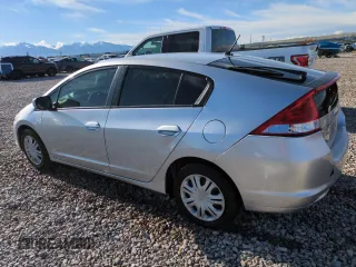 2010 Honda Insight LX with VIN JHMZE2H51AS011243, listed as a Copart auction lot 54445555 with 224,722 mi miles and Salvage Title. Bid and sale history available at DreamBid. Image 2.