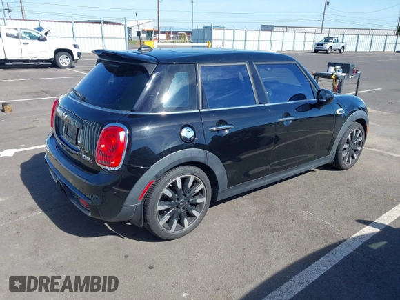 2015 MINI Hardtop 4 Door S z VIN WMWXU3C58F2B57218, wystawiony jako IAAI lot #42361437 z przebiegiem 96 984 mil mil oraz . Historia ofert i sprzedaży dostępna na DreamBid. Obrazek 4.