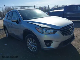 2016 Mazda CX-5 Touring with VIN JM3KE4CY1G0859053, listed as a IAAI auction lot 41817071 with 194,380 mi miles. Bid and sale history available at carsss.com. Image 1.