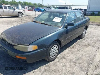 1995 Toyota Camry LE z VIN 4T1SK12E3SU576500, wystawiony jako IAAI lot #42186816 z przebiegiem 216 809 mil mil oraz . Historia ofert i sprzedaży dostępna na DreamBid. Obrazek 2.
