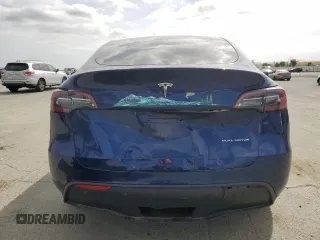 2021 Tesla Model Y Long Range with VIN 5YJYGDEEXMF192447, listed as a Copart auction lot 53550055 with 65,673 mi miles and Salvage Title. Bid and sale history available at DreamBid. Image 6.