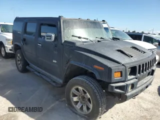2003 Hummer H2 with VIN 5GRGN23U13H143781, listed as a Copart auction lot 77833264 with 0 mi miles and Salvage Title. Bid and sale history available at carsss.com. Image 4.