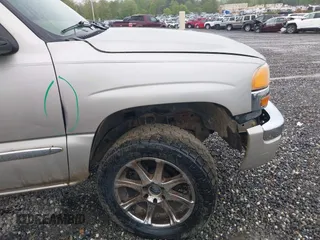 2004 GMC Sierra 1500 SLT with VIN 2GTEK19T841211511, listed as a IAAI auction lot 42099492 with 154,023 mi miles. Bid and sale history available at carsss.com. Image 13.