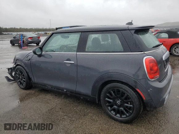 2014 MINI Hardtop S with VIN WMWXM7C54ET985344, listed as a Copart auction lot 52012465 with 87,017 mi miles and Salvage title. Bid and sale history available at DreamBid. Image 2.