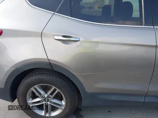 2018 Hyundai Santa Fe 2.4L with VIN 5NMZT3LB4JH069868, listed as a IAAI auction lot 42675555 with 142,612 mi miles and . Bid and sale history available at DreamBid. Image 6.