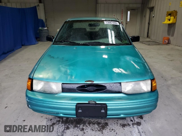 1995 Ford Escort z VIN 3FASP13J7SR205967, wystawiony jako Copart lot #73087444 z przebiegiem 100 401 mil mil oraz Szkoda całkowita • Salvage title. Historia ofert i sprzedaży dostępna na DreamBid. Obrazek 5.