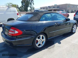 2004 Mercedes-Benz CLK-Class Cabriolet 5.0L with VIN WDBTK75G14T013879, listed as a IAAI auction lot 41964787 with 114,444 mi miles. Bid and sale history available at carsss.com. Image 4.