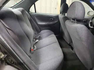 2000 Hyundai Elantra GLS z VIN KMHJF35F1YU995390, wystawiony jako Copart lot #78523024 z przebiegiem 130 349 mil mil oraz Szkoda całkowita • Salvage title. Historia ofert i sprzedaży dostępna na DreamBid. Obrazek 10.