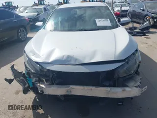 2019 Honda Civic Sport with VIN 19XFC2F81KE024702, listed as a IAAI auction lot 42018077 with 98,613 mi miles and . Bid and sale history available at DreamBid. Image 12.