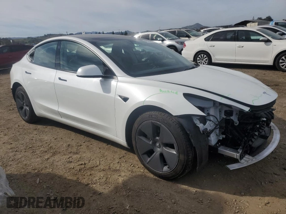 2023 Tesla Model 3 with VIN 5YJ3E1EA9PF546149, listed as a Copart auction lot 52104365 with 34,105 mi miles and Salvage Title. Bid and sale history available at DreamBid. Image 4.