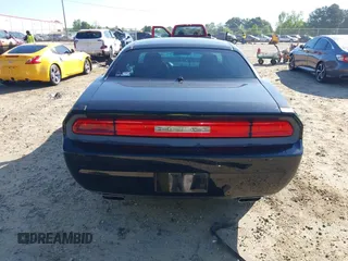 2013 Dodge Challenger SXT z VIN 2C3CDYAG4DH718894, wystawiony jako IAAI lot #42156336 z przebiegiem 153 000 mil mil oraz . Historia ofert i sprzedaży dostępna na DreamBid. Obrazek 16.
