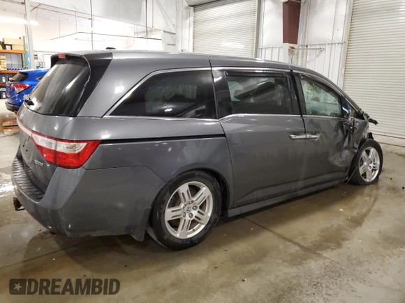2012 Honda Odyssey Touring with VIN 5FNRL5H98CB028309, listed as a Copart auction lot 57663485 with 233,921 mi miles and Salvage title. Bid and sale history available at DreamBid. Image 3.