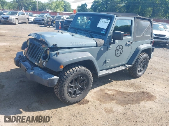 2015 Jeep Wrangler Freedom Edition with VIN 1C4AJWAG1FL714002, listed as a IAAI auction lot 42579024 with 98,732 mi miles and . Bid and sale history available at DreamBid. Image 2.
