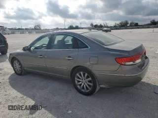 2009 Hyundai Azera Limited z VIN KMHFC46FX9A373084, wystawiony jako Copart lot #45532865 z przebiegiem 107 592 mil mil oraz Szkoda całkowita • Salvage title. Historia ofert i sprzedaży dostępna na DreamBid. Obrazek 2.