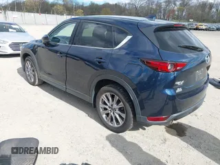 2019 Mazda CX-5 Grand Touring with VIN JM3KFBDM2K0603400, listed as a IAAI auction lot 42051135 with 59,448 mi miles and . Bid and sale history available at DreamBid. Image 3.