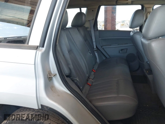 2005 Jeep Grand Cherokee Laredo z VIN 1J4HS48N65C563266, wystawiony jako IAAI lot #42784524 z przebiegiem 156 702 mil mil oraz . Historia ofert i sprzedaży dostępna na DreamBid. Obrazek 8.