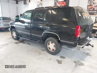 1996 GMC Yukon with VIN 1GKEK13R2TJ743987, listed as a IAAI auction lot 41652826 with 325,292 mi miles. Bid and sale history available at carsss.com. Image 3.