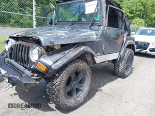 2003 Jeep Wrangler Sport z VIN 1J4FA49S53P317779, wystawiony jako IAAI lot #42388780 z przebiegiem Nie podano mil oraz . Historia ofert i sprzedaży dostępna na DreamBid. Obrazek 16.