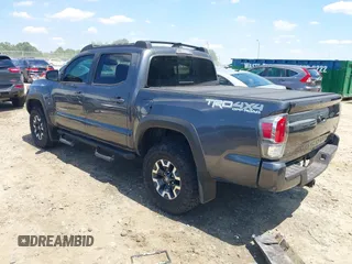 2023 Toyota Tacoma SR with VIN 3TMCZ5AN9PM553246, listed as a IAAI auction lot 42201812 with 20,907 mi miles and . Bid and sale history available at DreamBid. Image 3.