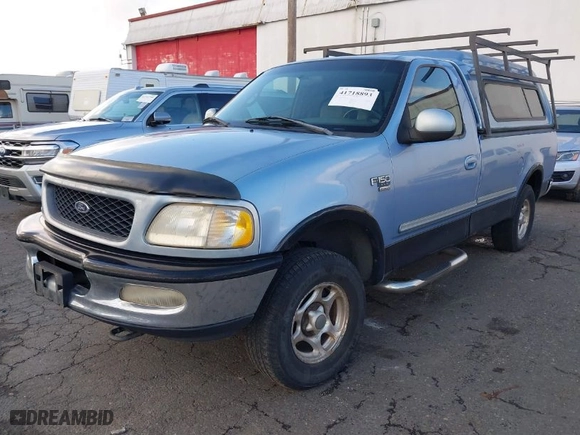 1998 Ford F-150 Standard with VIN 1FTZF18W3WKB01356, listed as a IAAI auction lot 41718893 with 261,717 mi miles. Bid and sale history available at carsss.com. Image 2.