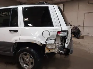 1997 Jeep Grand Cherokee Laredo z VIN 1J4GZ58S9VC562907, wystawiony jako IAAI lot #42102313 z przebiegiem 137 672 mil mil oraz . Historia ofert i sprzedaży dostępna na DreamBid. Obrazek 6.