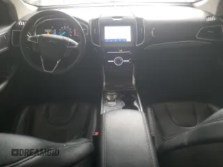 2019 Ford Edge Titanium z VIN 2FMPK4K94KBC11873, wystawiony jako Copart lot #58737735 z przebiegiem 127 278 mil mil oraz Czysty tytuł • Clean title. Historia ofert i sprzedaży dostępna na DreamBid. Obrazek 8.