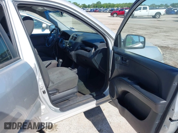 2009 Kia Sportage LX with VIN KNDJF724X97556574, listed as a IAAI auction lot 42206080 with 115,868 mi miles and . Bid and sale history available at carsss.com. Image 5.