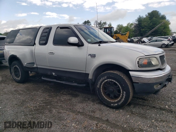 2000 Ford F-150 XL with VIN 2FTRX08L2YCA22507, listed as a Copart auction lot 55390075 with 197,785 mi miles and Salvage title. Bid and sale history available at DreamBid. Image 4.